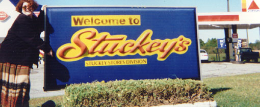 jpg of Elizabeth in front of the Stuckey's 
sign